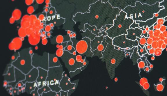 Mappa geografica del mondo con bolli rossi di dimensioni diverse che indicano la presenza di patologie